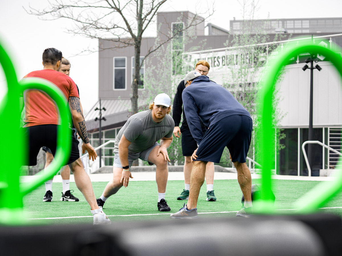 Football Players practicing with FlipSled